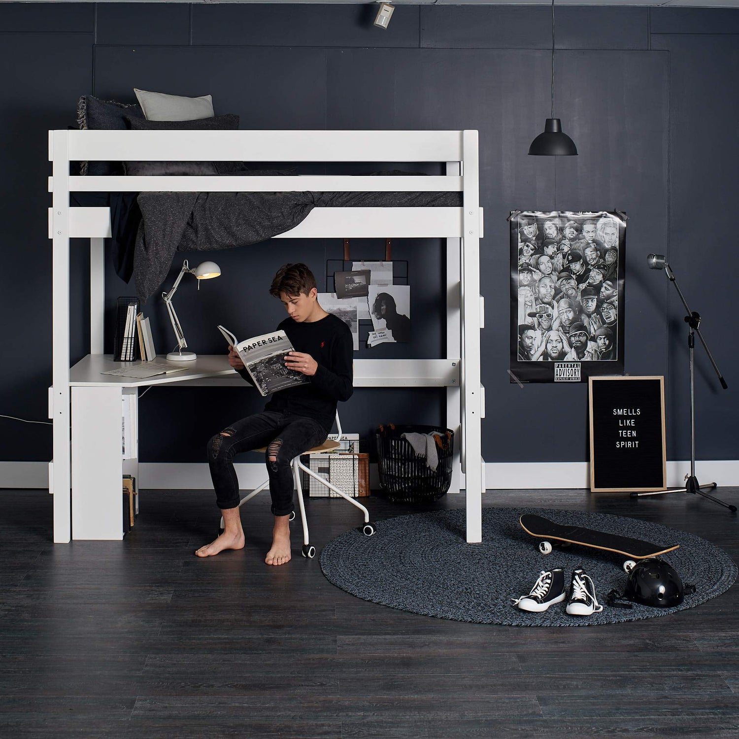 White loft bed above desk study space for teenager