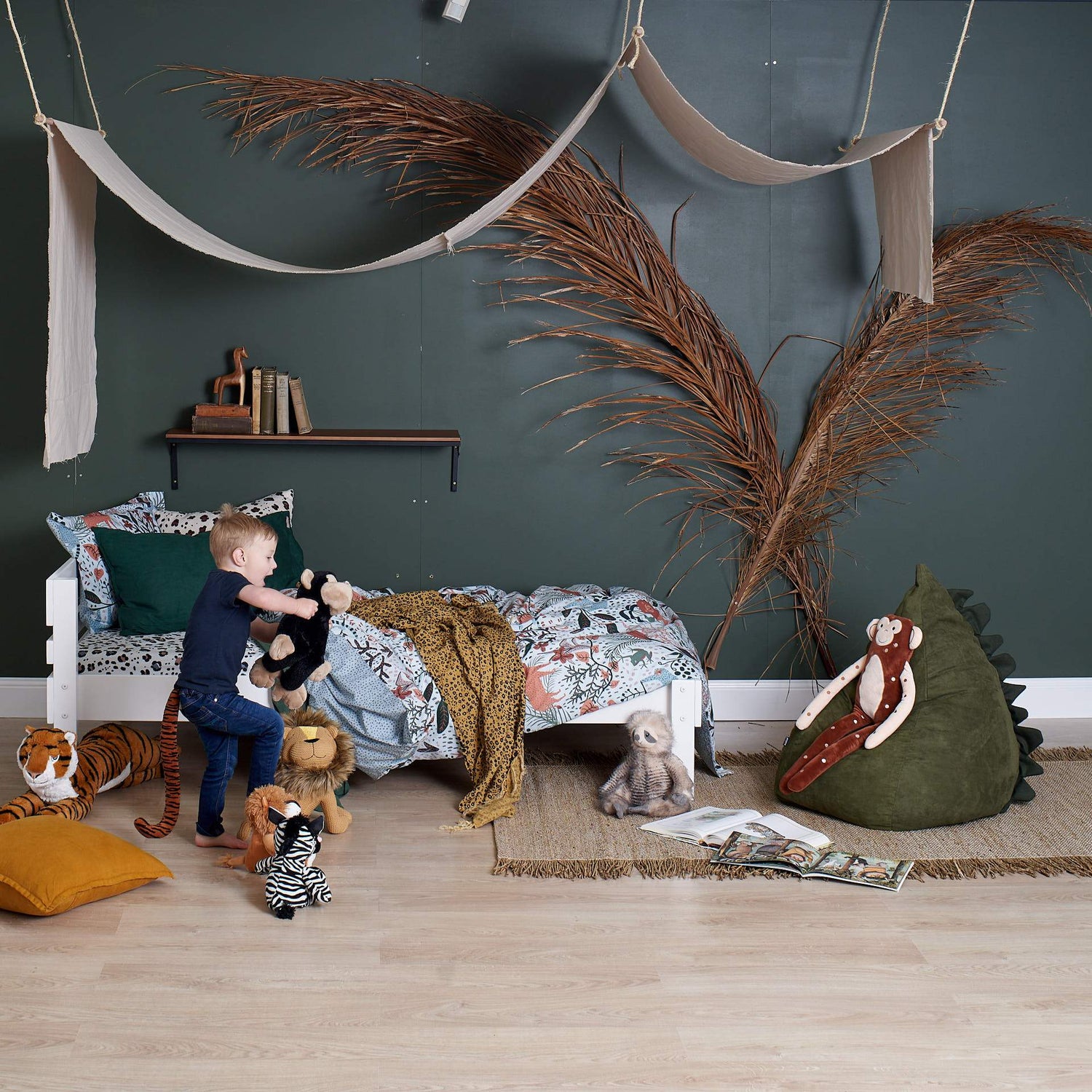 single timber bed in white paint finish with roaring kid playing