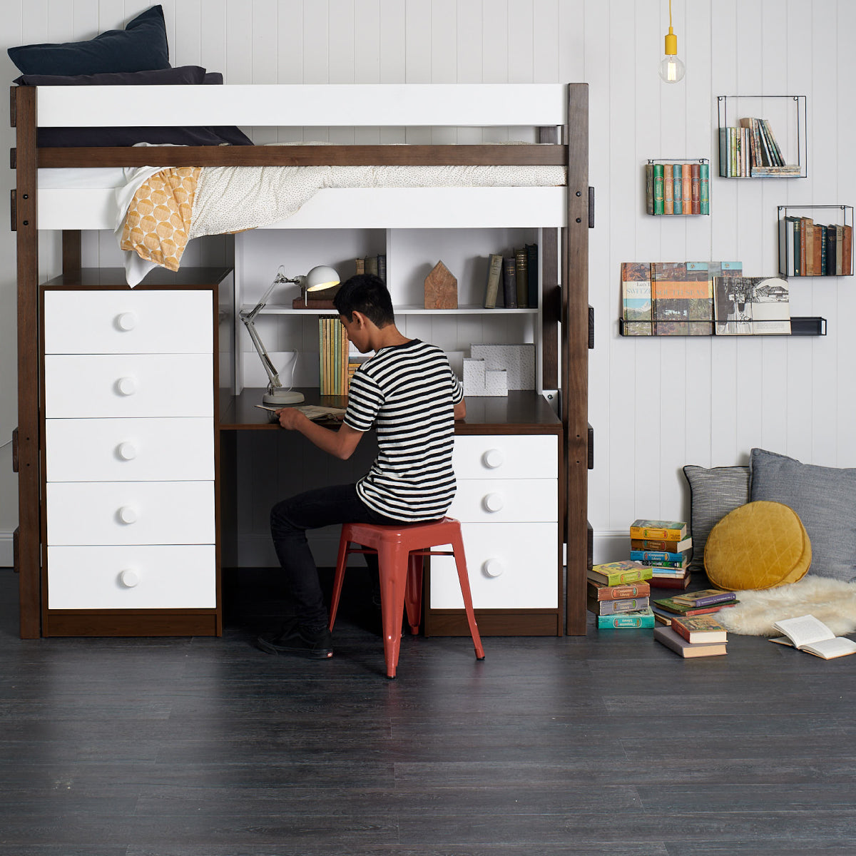 loft bed above large study desk with storage drawers and shelving