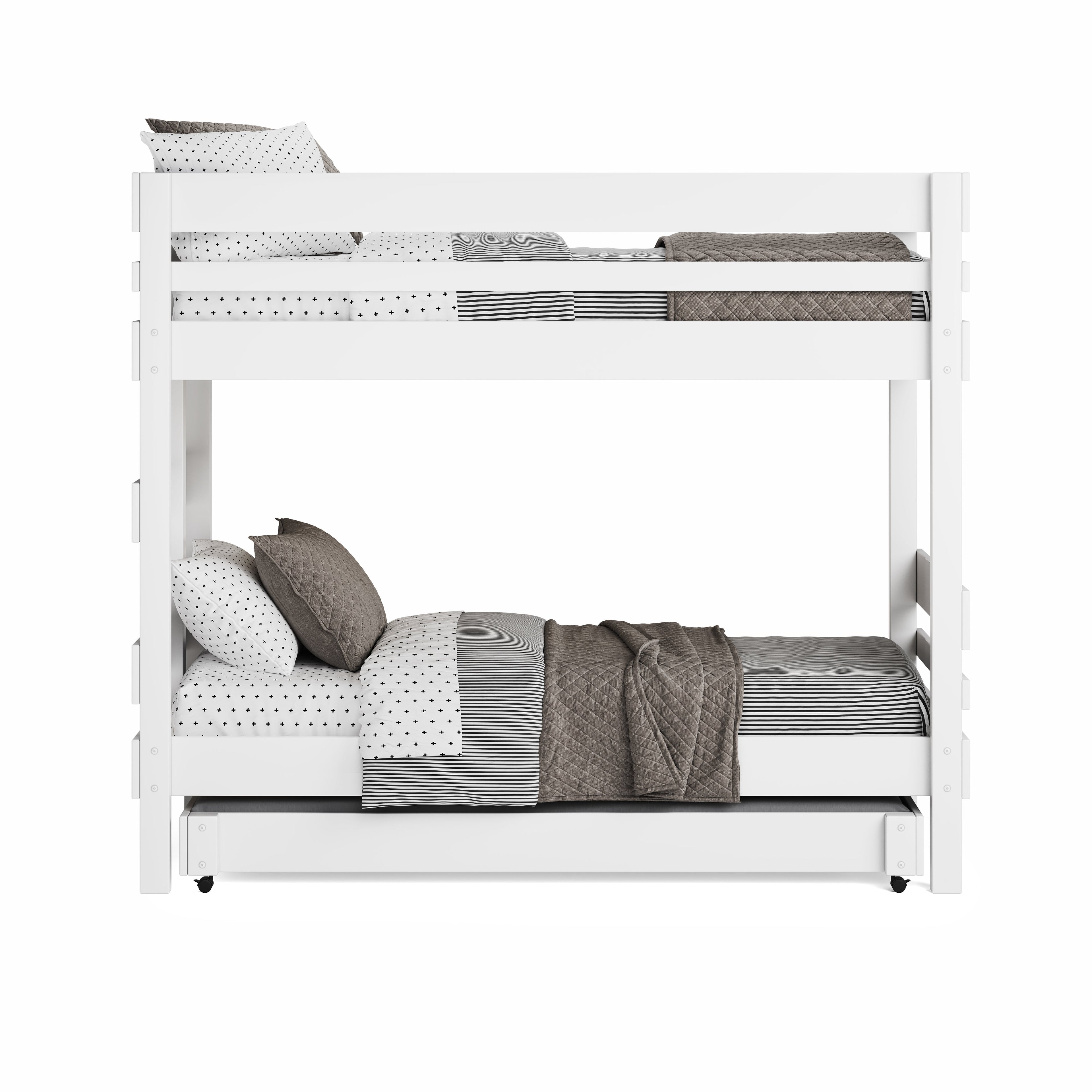 White wooden bunk bed with guardrails, bedding in neutral tones, and trundle bed below.