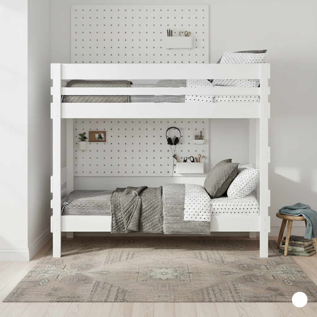 White wooden bunk bed with slatted safety rails and matching bedding in a bright, minimalist room.