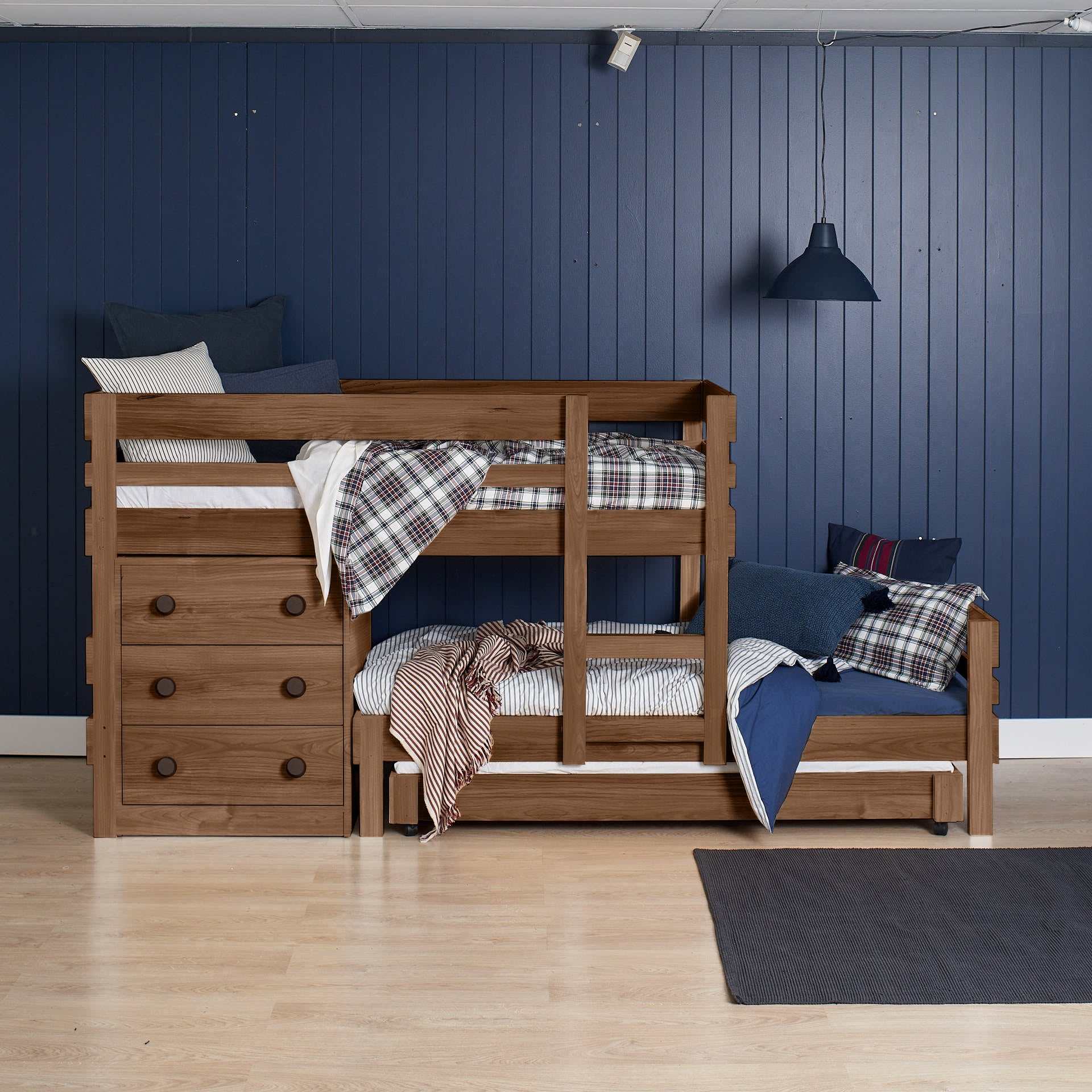Native elm low height long-wall bunk bed with built-in staircase drawers and wooden safety rails.
