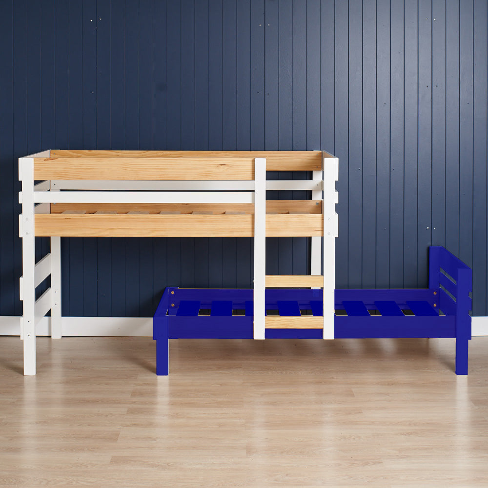 Wood and white loft bed frame with integrated ladder next to a blue single bunk bed frame against a navy paneled wall.