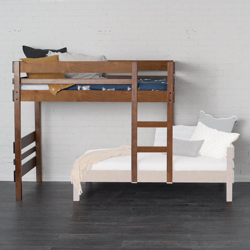 Native Elm mid-line loft bed with integrated ladder and safety rails on a dark floor.