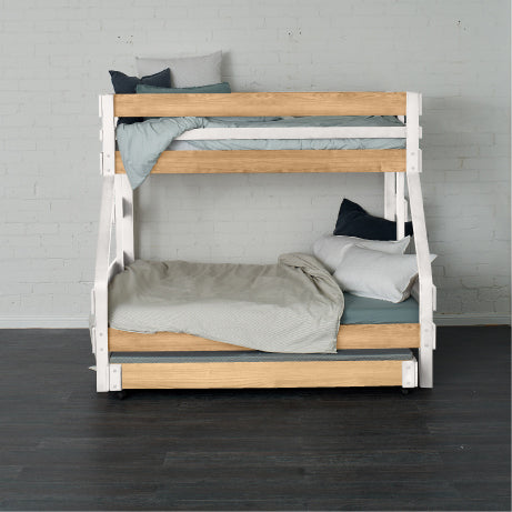 White and natural wood single over double bunk bed with ladder and bedding.