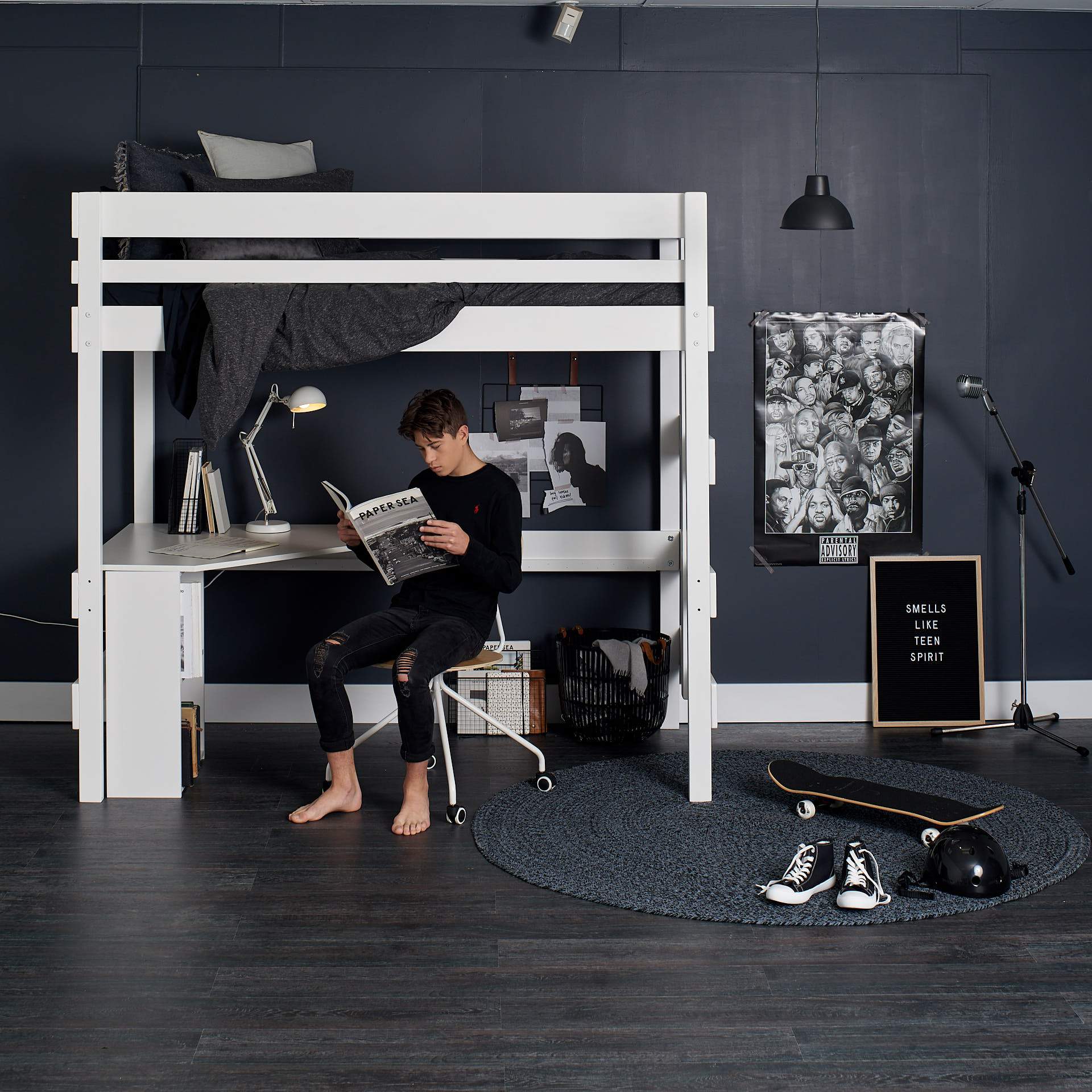 White loft bed above desk study space for teenager
