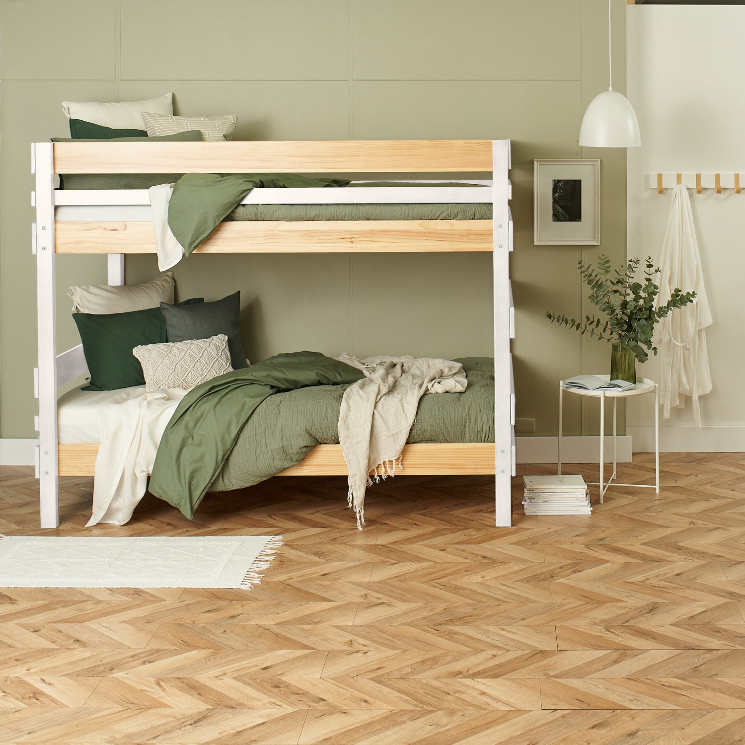White and natural wood bunk bed with green bedding in modern bedroom setting.