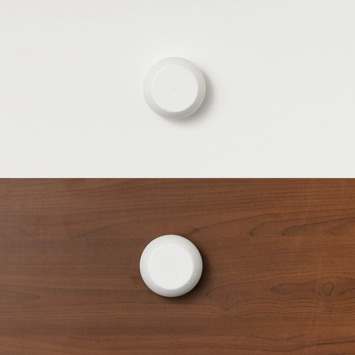 White round handle on white timber and clear timber, designed for bunk bed or loft bed furniture.
