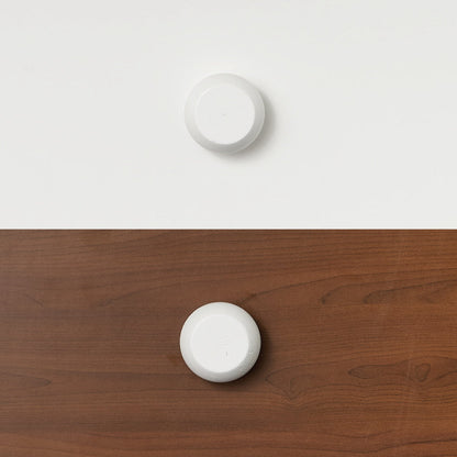 White round handle on white timber and clear timber, designed for bunk bed or loft bed furniture.
