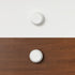 White round handle on white timber and clear timber, designed for bunk bed or loft bed furniture.