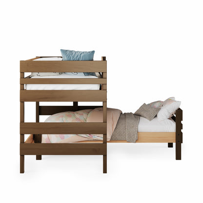 Low height corner bunk bed in native elm with guardrails and bedding in muted tones.