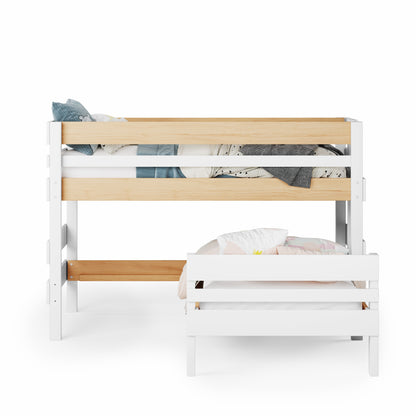 Low height corner bunk bed in white and natural wood with guardrails and lower bed perpendicular to upper bed.