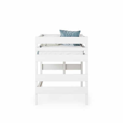 White low height high bed with clean lines and safety rails, styled with a blue pillow.