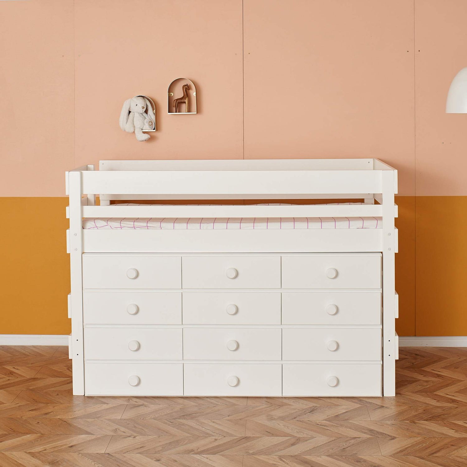 close up low height loft bed with incredible storage in white finish