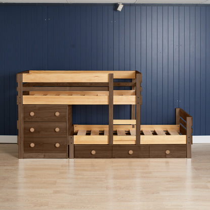 Low height long-wall bunk bed in elm wood with integrated chest drawers and slide-out trundle bed on light floor and blue.