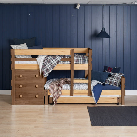 Low height long-wall bunk bed in native elm with built-in storage drawers and side steps.