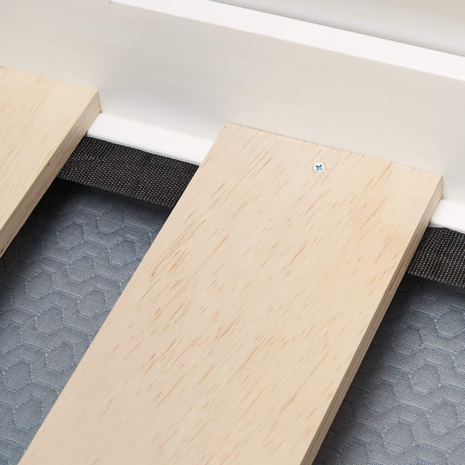 Timber bed slat base fixing close up