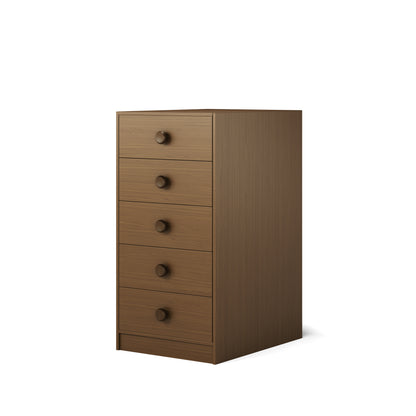 Tall wooden chest of five drawers in natural elm finish with round handles. 