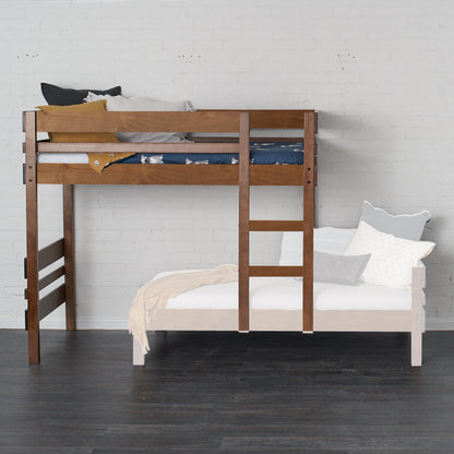 Native Elm mid-line loft bed with integrated ladder and safety rails on a dark floor.