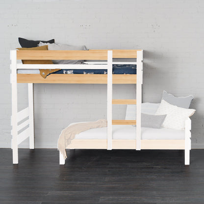 White mid-line bunk bed with native elm accents and built-in ladder against white wall.