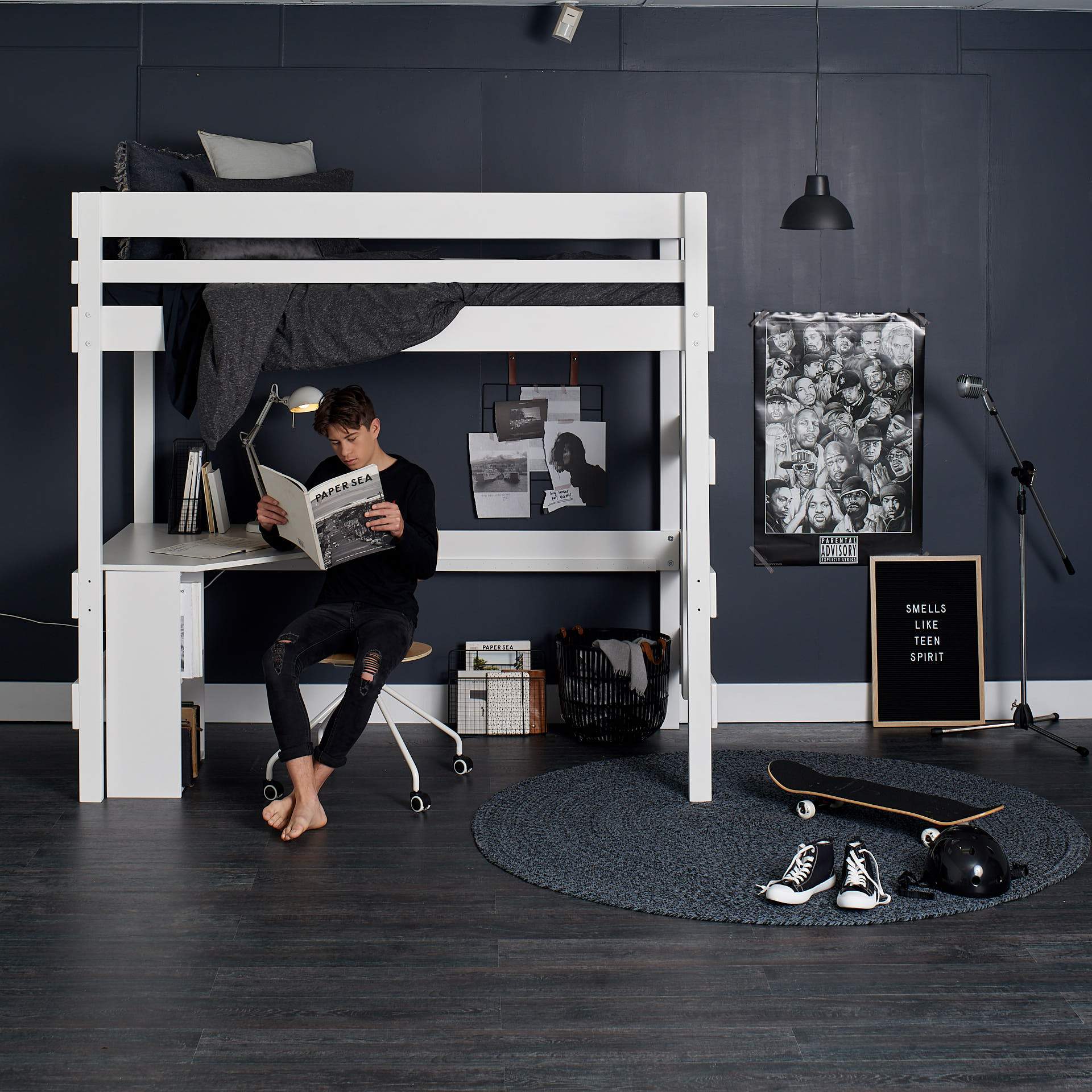 teenage boy at loft bed with study desk