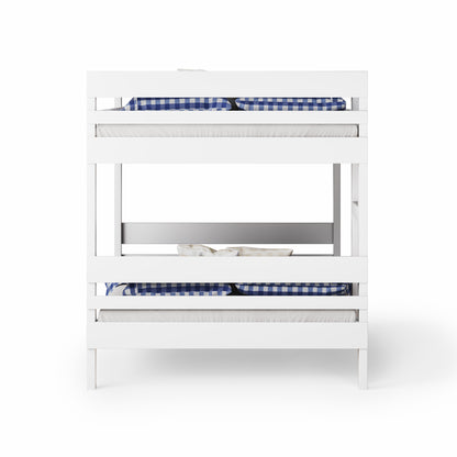 White bunk bed with side ladder access and navy blue checkered bedding.