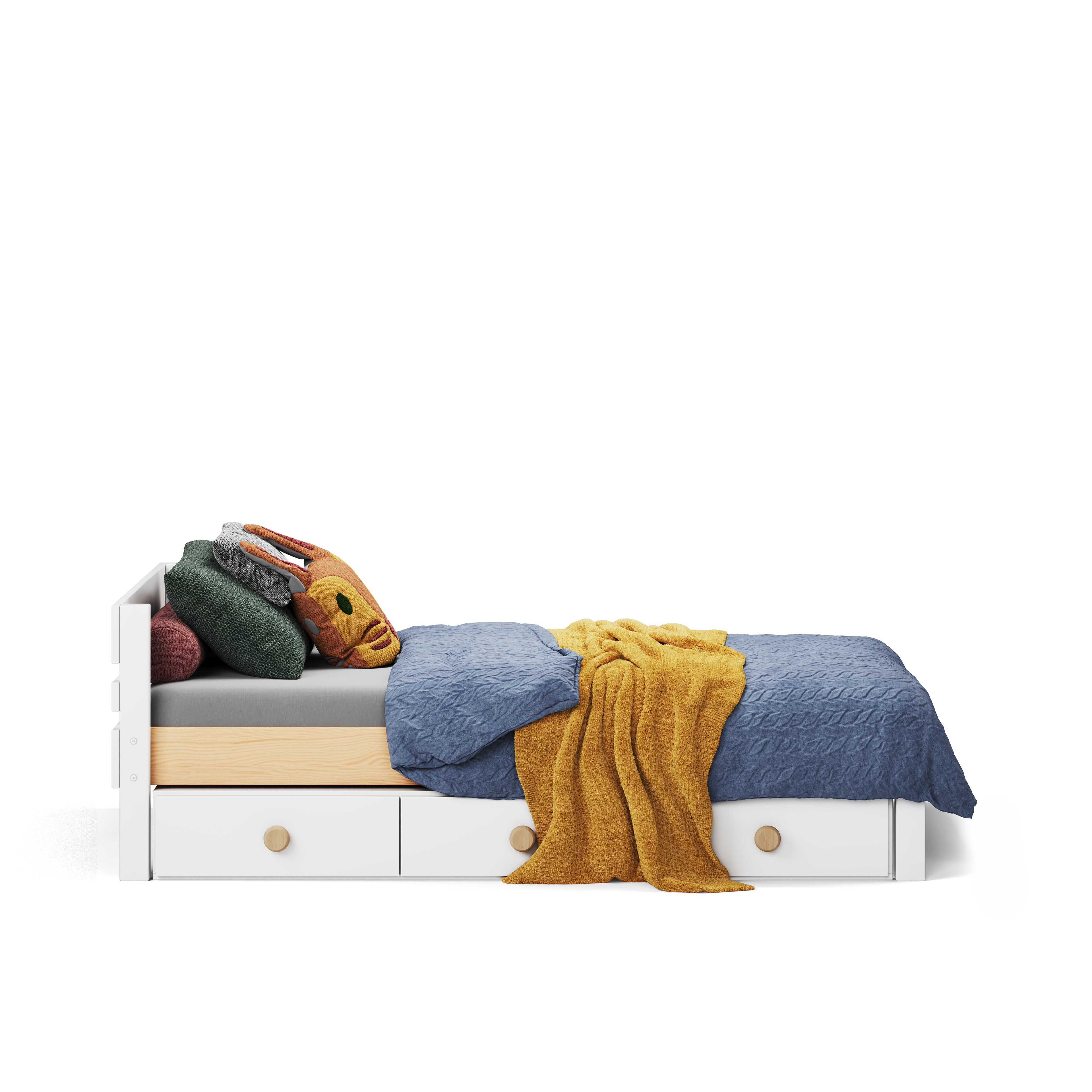 White single bed with storage drawers, blue and yellow bedding, and colorful pillows.