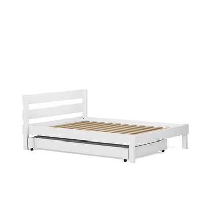 White single bed with slatted wooden base and pull-out trundle drawer underneath.