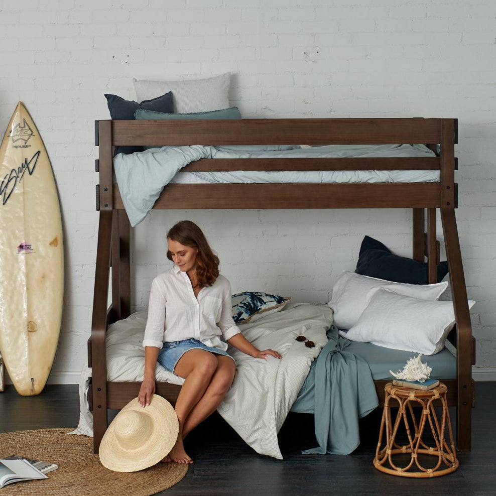 Strong timber single bed over double bunk bed