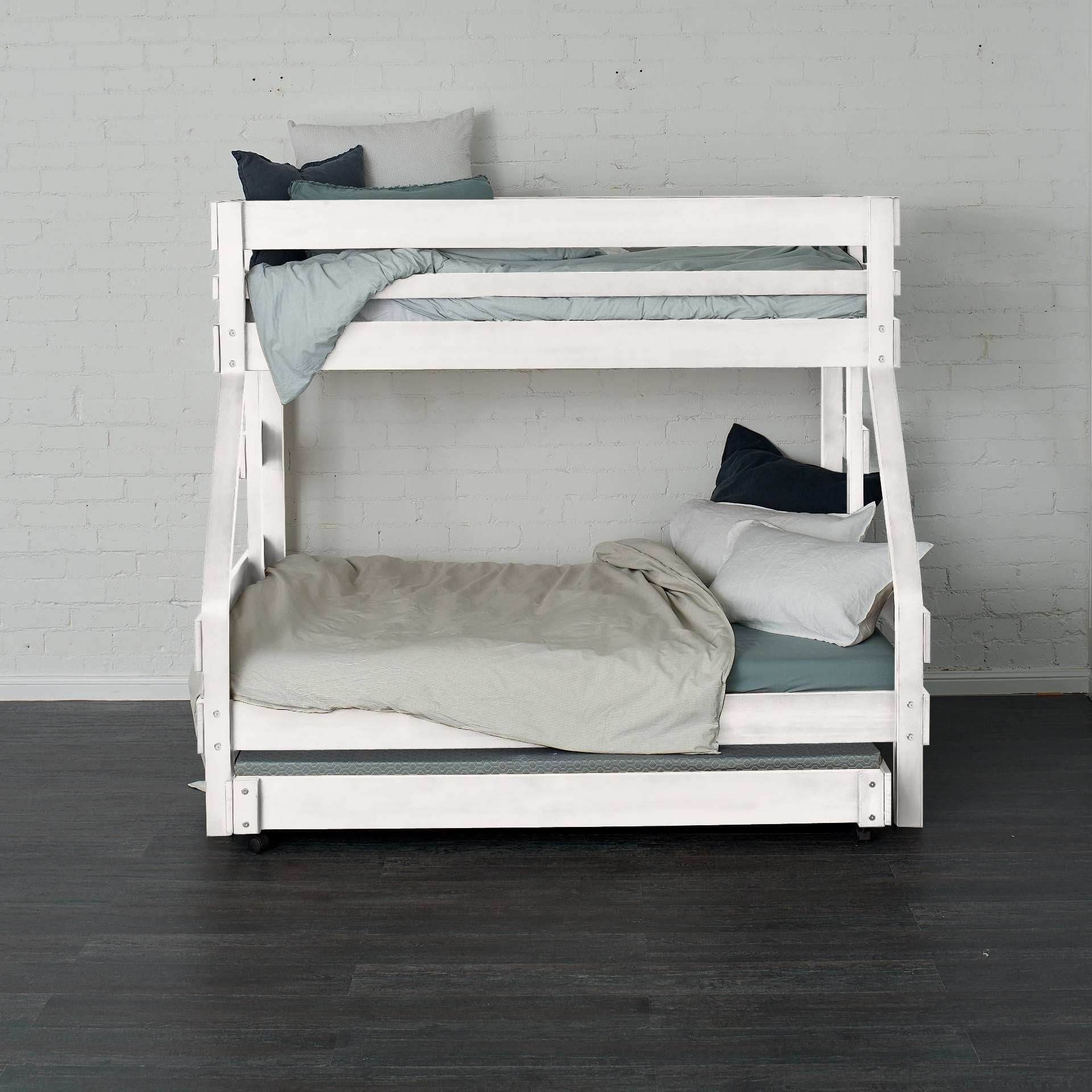 White single over double bunk bed with clean lines and minimalist design.