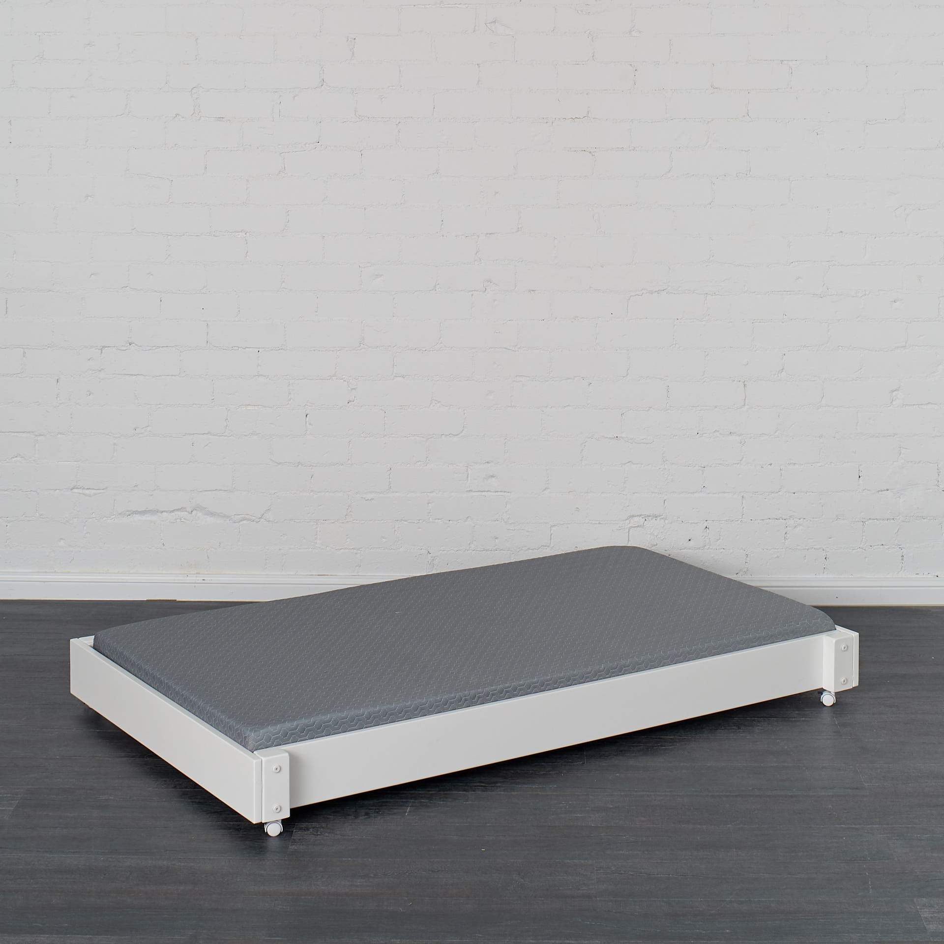 Trundle bed pictured in white finish with trundle mattress