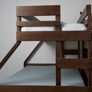 Single over double timber bunk bed ladder close up view