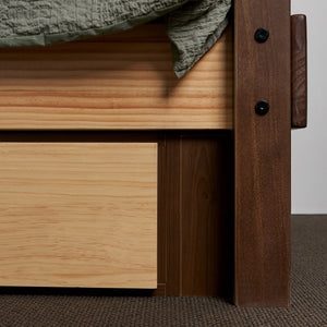 Close up of king single plate for under bed storage drawers. Pictured in elm finish with clear pine drawer fronts.